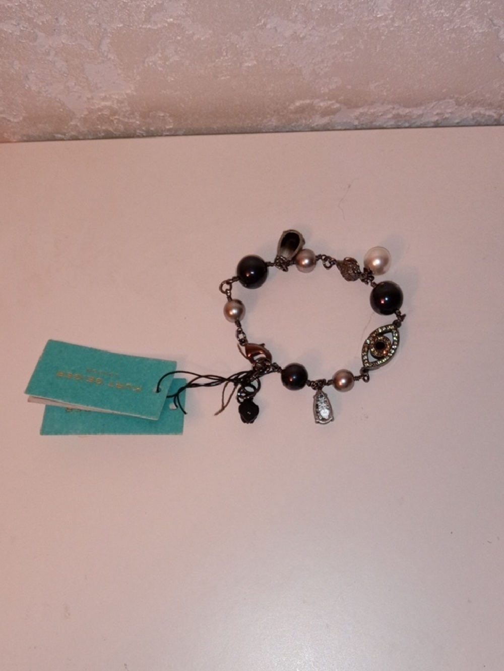 Kurt Geiger Pearl and Black Bead Charm Bracelet with Mixed Metal Accents